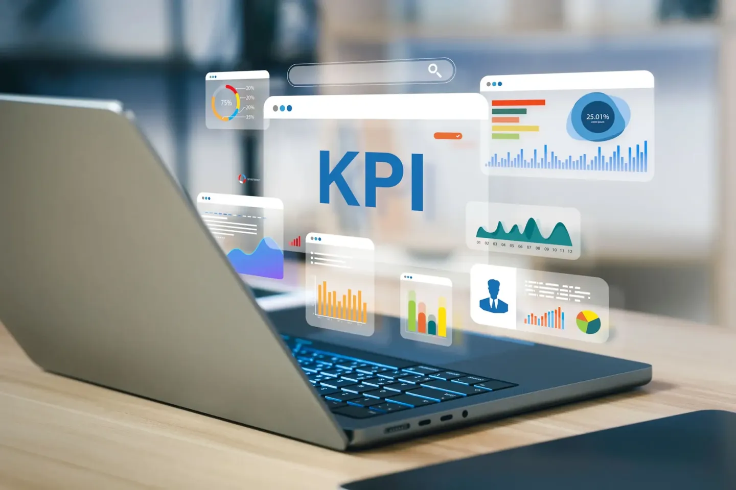 Laptop displaying KPI dashboards and data analytics charts.