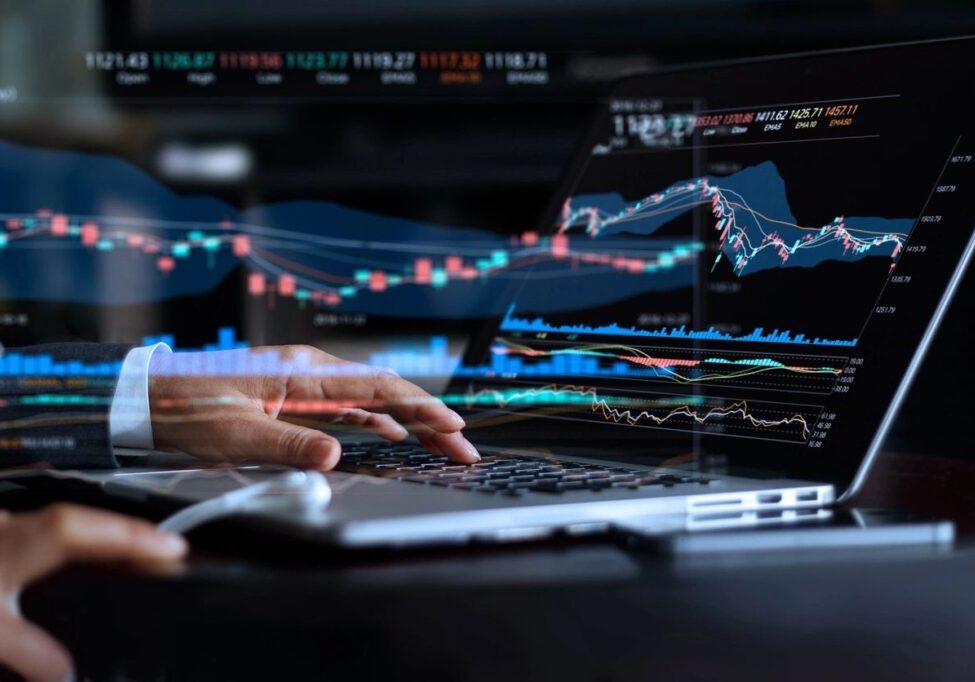 Person analyzing financial data charts on a laptop screen.